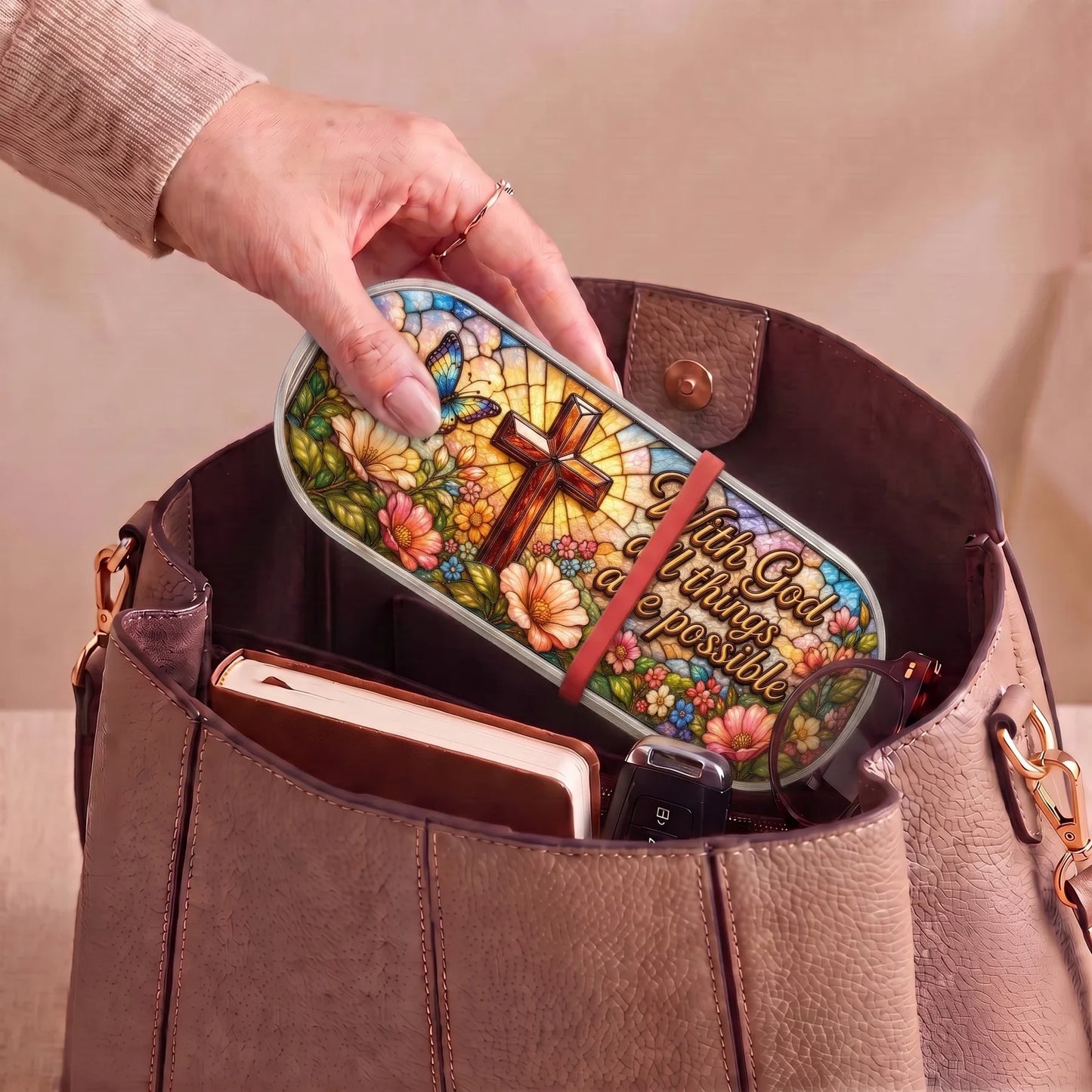 With God All Things Are Possible floral cross Pillcase carried inside a handbag with everyday essentials