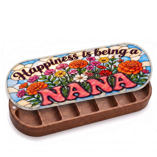 Open wooden Happiness Is Being a Nana Pillcase with colorful flowers on a stained-glass-style lid on white