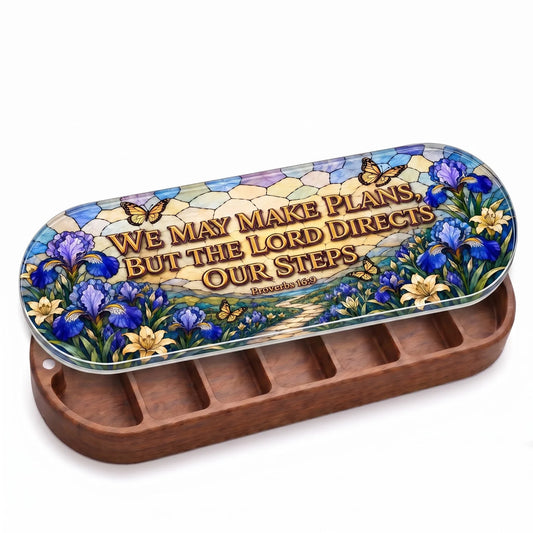 Open wooden Proverbs 16:9 Pillcase with blue irises and butterflies on a stained-glass-style lid on white