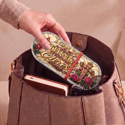 Philippians 4:13 floral-cross Pillcase carried inside a handbag with everyday essentials