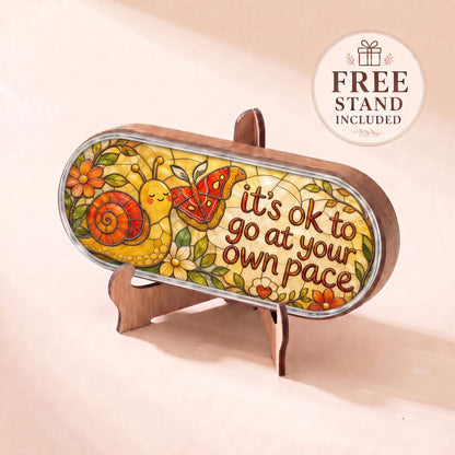 "It’s OK to Go at Your Own Pace — Snail & Butterfly Stained Glass" Pill Case — snail and butterfly plaque displayed on the included wooden stand