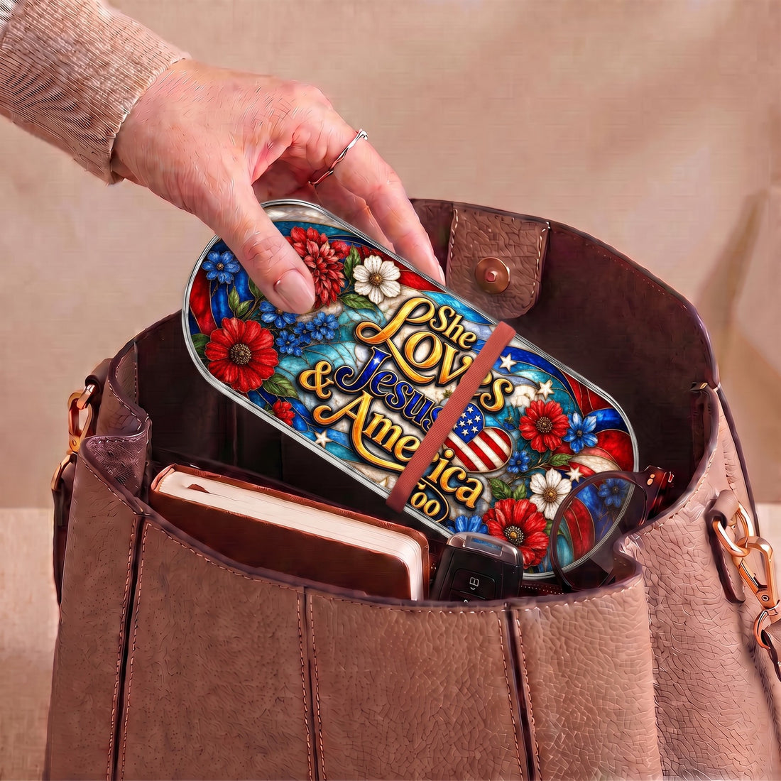 She Loves Jesus and America Too patriotic Pillcase carried inside a handbag with everyday essentials