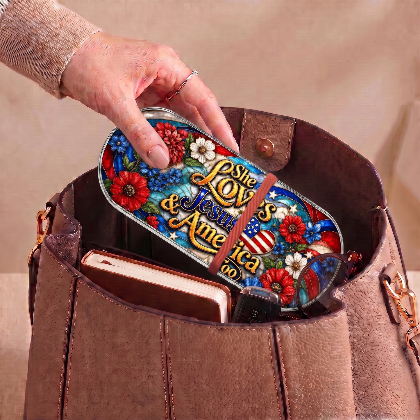 She Loves Jesus and America Too patriotic Pillcase carried inside a handbag with everyday essentials