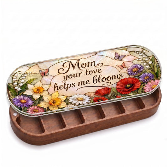 Open wooden Mom Your Love Helps Me Bloom Pillcase with poppies, daffodils and butterflies on a stained-glass-style lid on white