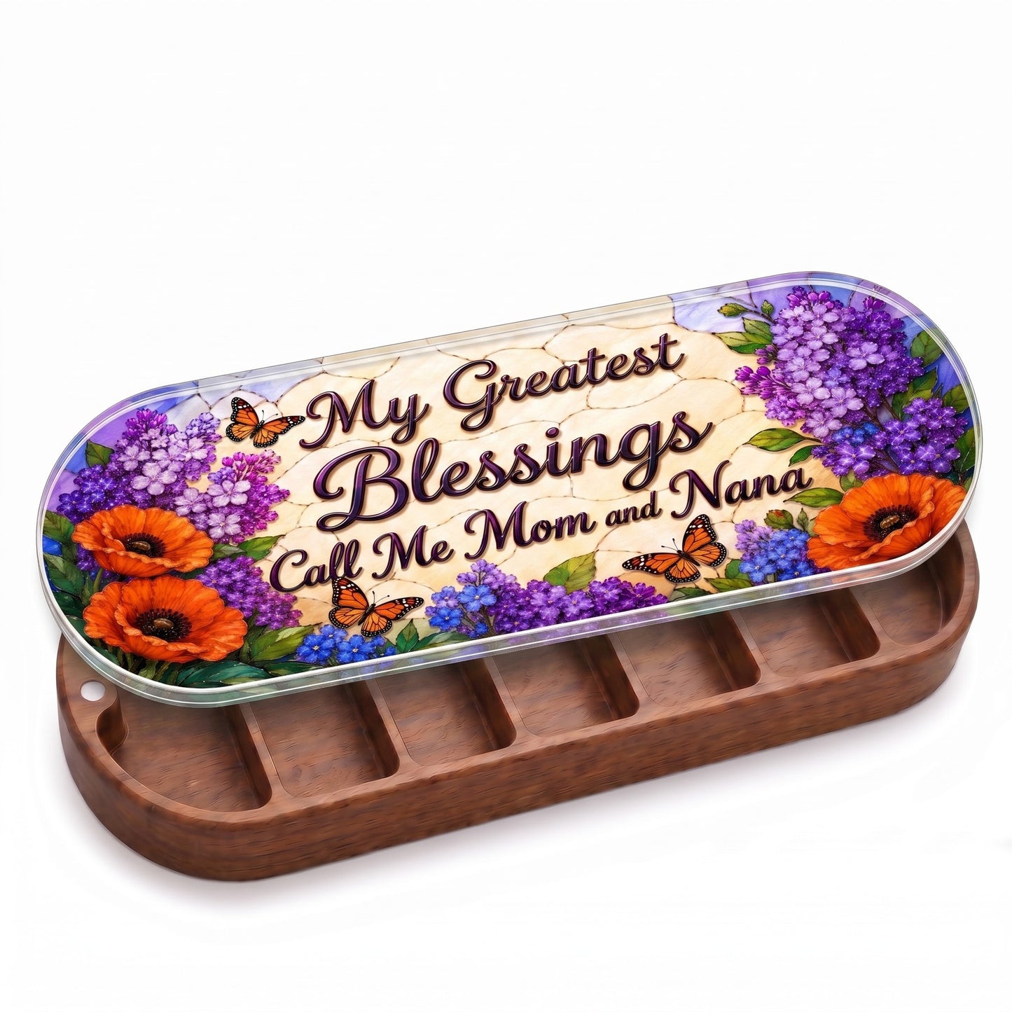 Open wooden My Greatest Blessings Call Me Mom and Nana Pillcase with purple flowers, orange poppies and monarch butterflies on a stained-glass-style lid on white