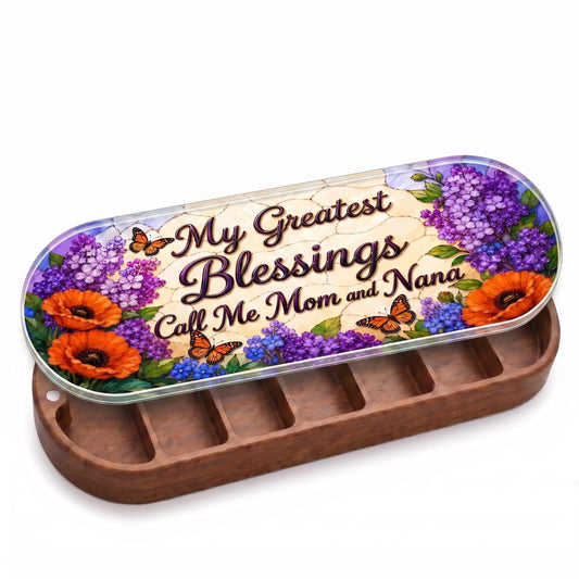 Open wooden My Greatest Blessings Call Me Mom and Nana Pillcase with purple flowers, orange poppies and monarch butterflies on a stained-glass-style lid on white