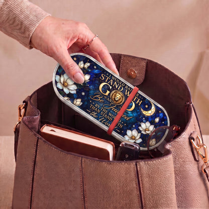 Stand with God celestial Pillcase carried inside a handbag with everyday essentials