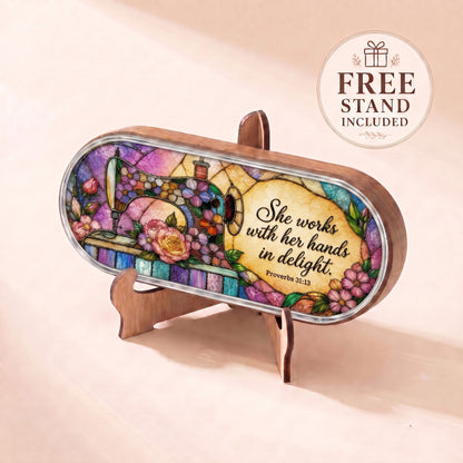 She Works with Her Hands in Delight Proverbs 31:13 sewing floral Pillcase displayed on included wooden stand