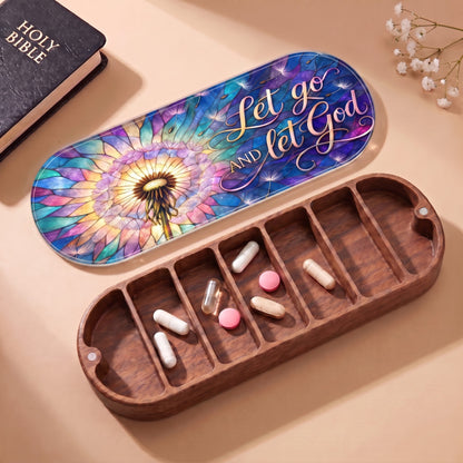 Open wooden Pillcase with Let Go and Let God lid, Holy Bible and daily tablets