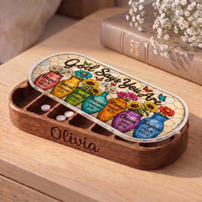 "God Says You Are — Christian Affirmation Floral Mosaic" Pill Case — personalized open God Says You Are floral Pill Case on a wooden table
