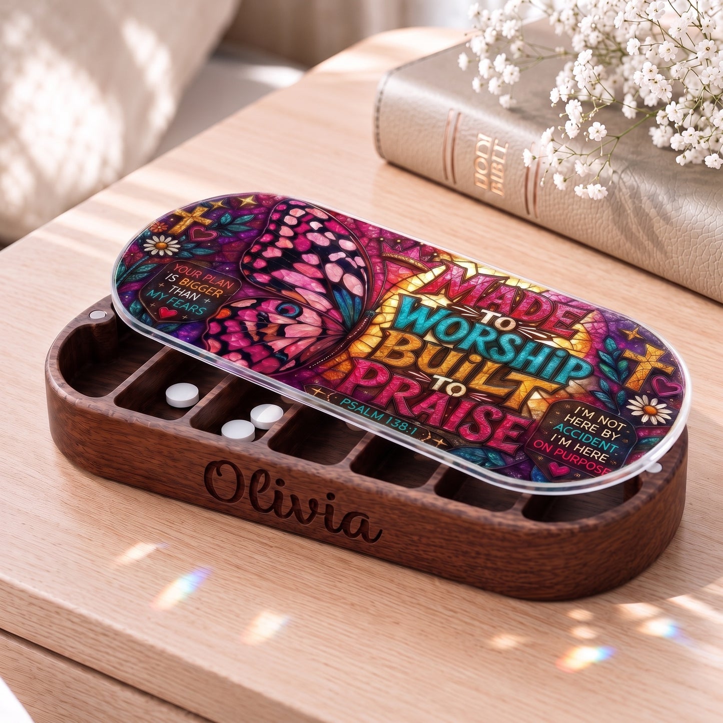 Personalized Olivia wooden Pillcase with Made to Worship Built to Praise butterfly stained-glass artwork beside a Holy Bible