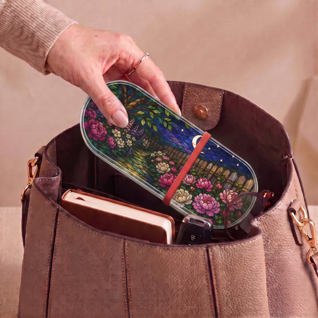 Moonlit Garden floral Pillcase carried inside a handbag with everyday essentials
