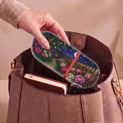 Moonlit Garden floral Pillcase carried inside a handbag with everyday essentials