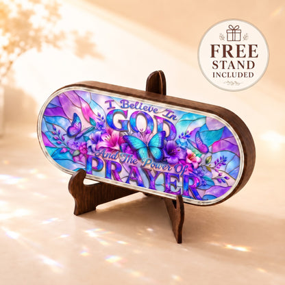 I Believe in God and the Power of Prayer Pillcase displayed on included wooden stand