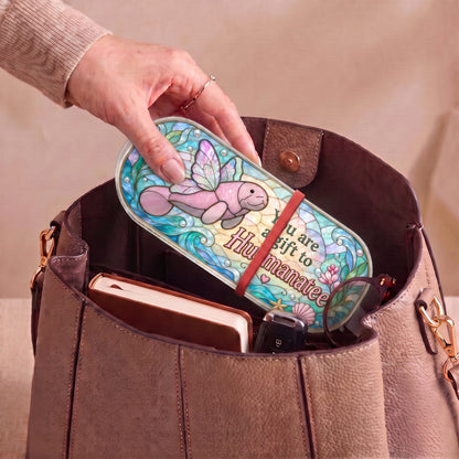 "You Are a Gift to Hu-manatee — Winged Manatee Stained Glass" Pill Case — You Are a Gift to Hu-manatee Pill Case carried inside a handbag