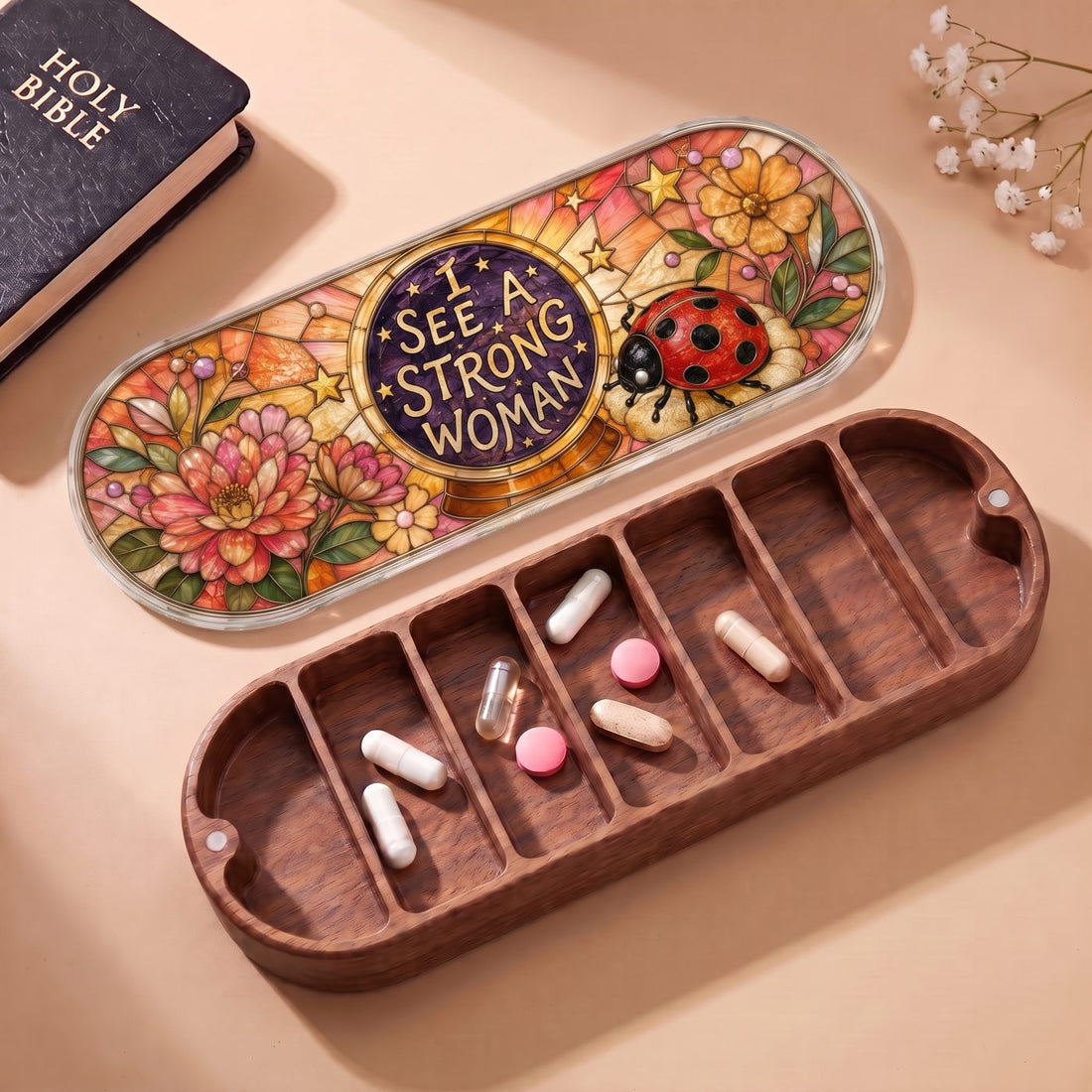 "I See a Strong Woman — Ladybug & Floral Stained Glass" Pill Case — open Pill Case with Holy Bible, flowers, ladybug artwork, and assorted pills