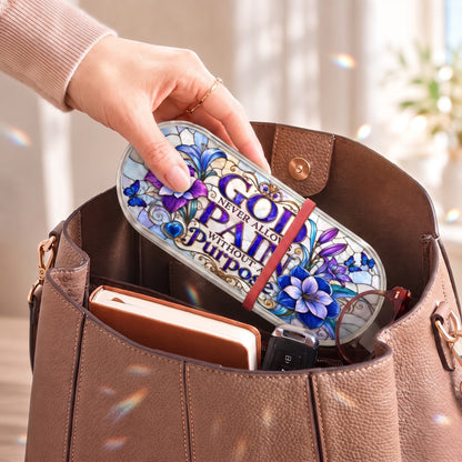 Purple floral butterfly Pillcase carried inside a handbag with everyday essentials