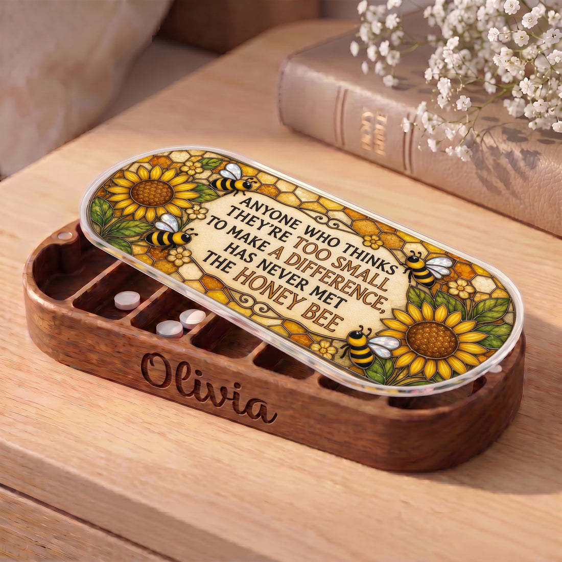 Personalized wooden Pillcase with honey bee quote lid and white tablets on bedside table