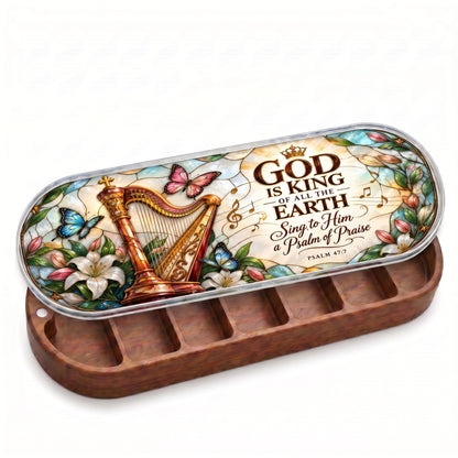 Open wooden Pillcase with God Is King Psalm 47:7 harp and floral stained-glass lid on white