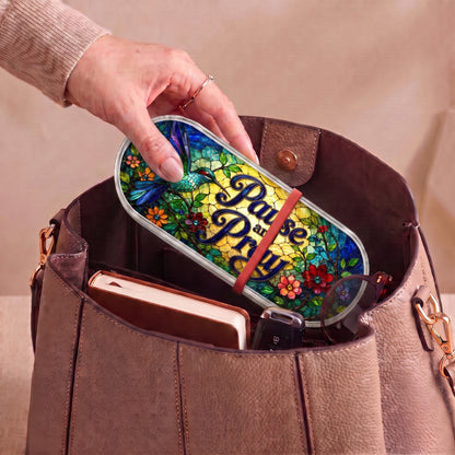 Pause and Pray hummingbird garden Pillcase carried inside a handbag with everyday essentials