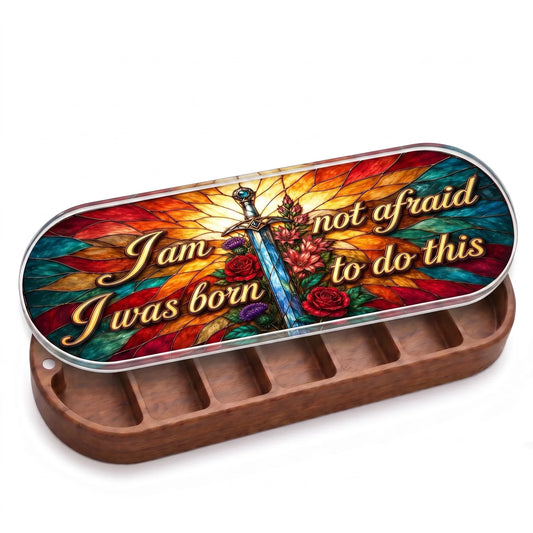 Open wooden I Am Not Afraid, I Was Born to Do This Pillcase with sword-and-roses stained-glass-style lid on white
