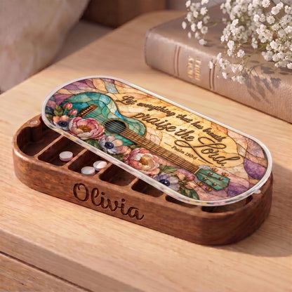 "Let Everything That Has Breath Praise the Lord — Psalm 150:6" Pill Case — personalized open Pill Case with turquoise guitar artwork on wooden table