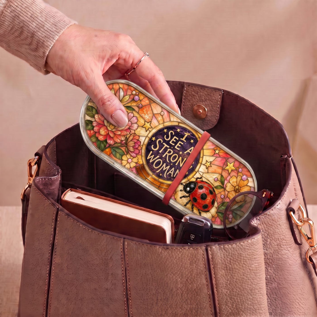 "I See a Strong Woman — Ladybug & Floral Stained Glass" Pill Case — I See a Strong Woman ladybug Pill Case carried inside a handbag