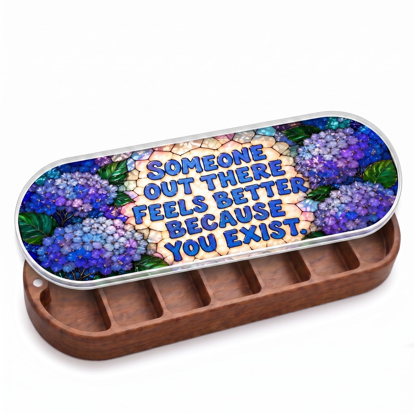 Open wooden Someone Out There Feels Better Because You Exist Pillcase with blue hydrangeas on a stained-glass-style lid on white
