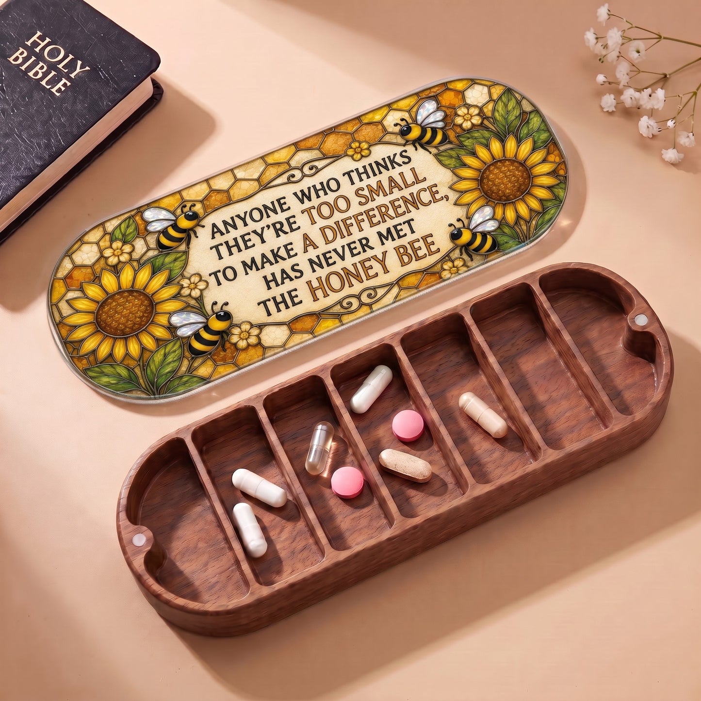 Open wooden Pillcase with honey bee quote lid, Holy Bible and daily tablets