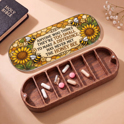 Open wooden Pillcase with honey bee quote lid, Holy Bible and daily tablets