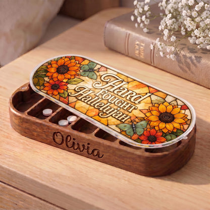 "Hard Fought Hallelujah — Sunflower & Butterfly Stained Glass" Pill Case — personalized open Pill Case on a wooden table