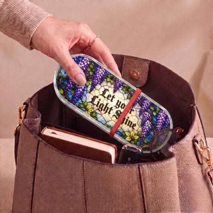 Let Your Light Shine wisteria Pillcase carried inside a handbag with everyday essentials