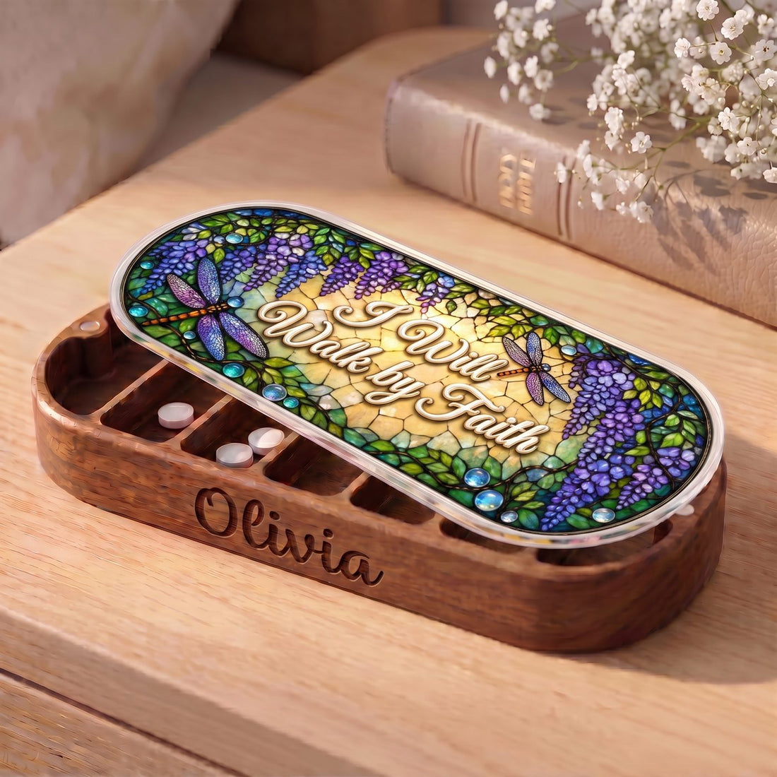 "I Will Walk by Faith — Wisteria & Dragonfly Stained Glass" Pill Case — personalized open wisteria and dragonfly Pill Case on a wooden table