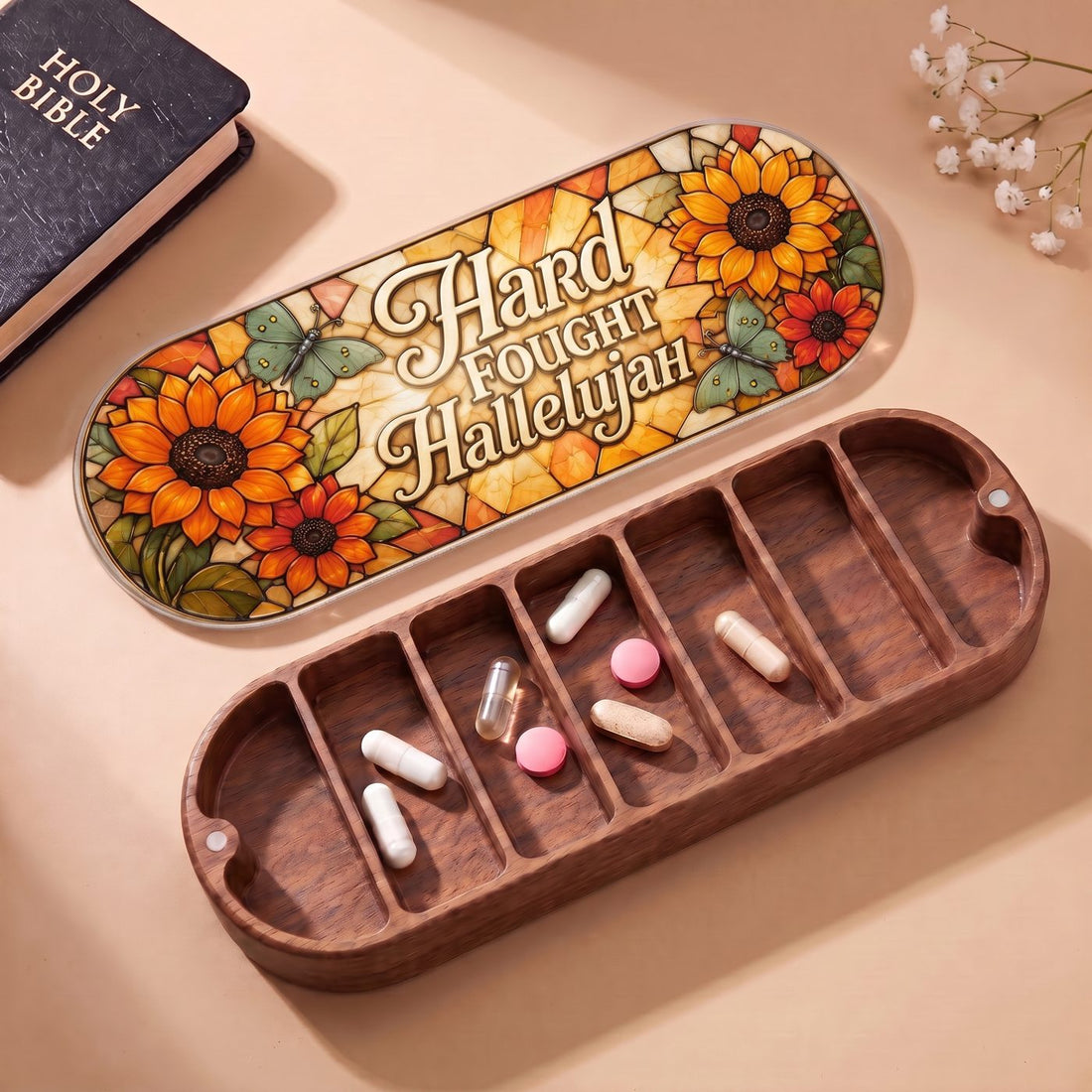 "Hard Fought Hallelujah — Sunflower & Butterfly Stained Glass" Pill Case — open Pill Case with Holy Bible and flowers
