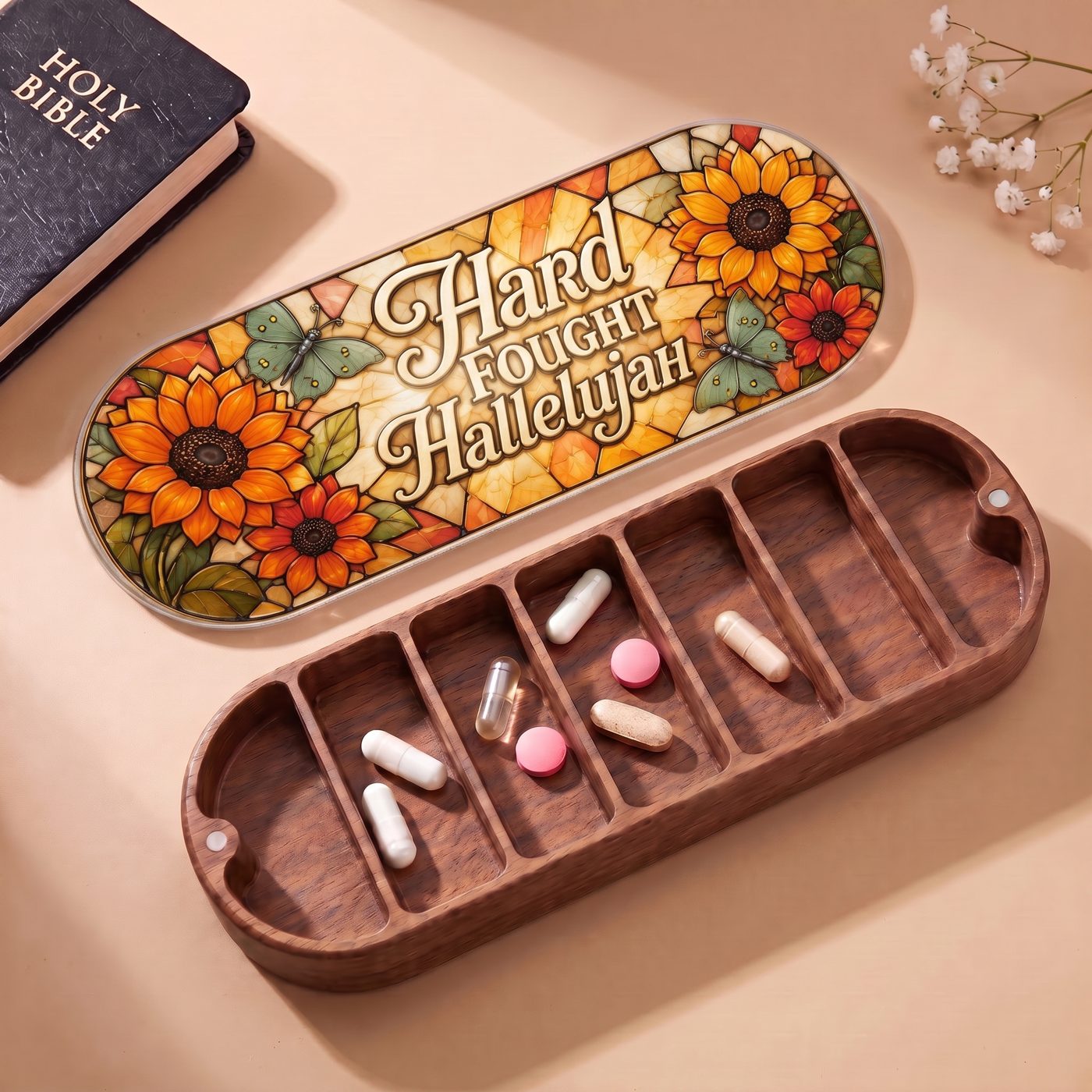 "Hard Fought Hallelujah — Sunflower & Butterfly Stained Glass" Pill Case — open Pill Case with Holy Bible and flowers