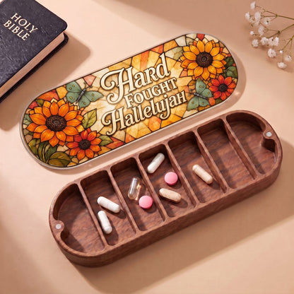 "Hard Fought Hallelujah — Sunflower & Butterfly Stained Glass" Pill Case — open Pill Case with Holy Bible and flowers