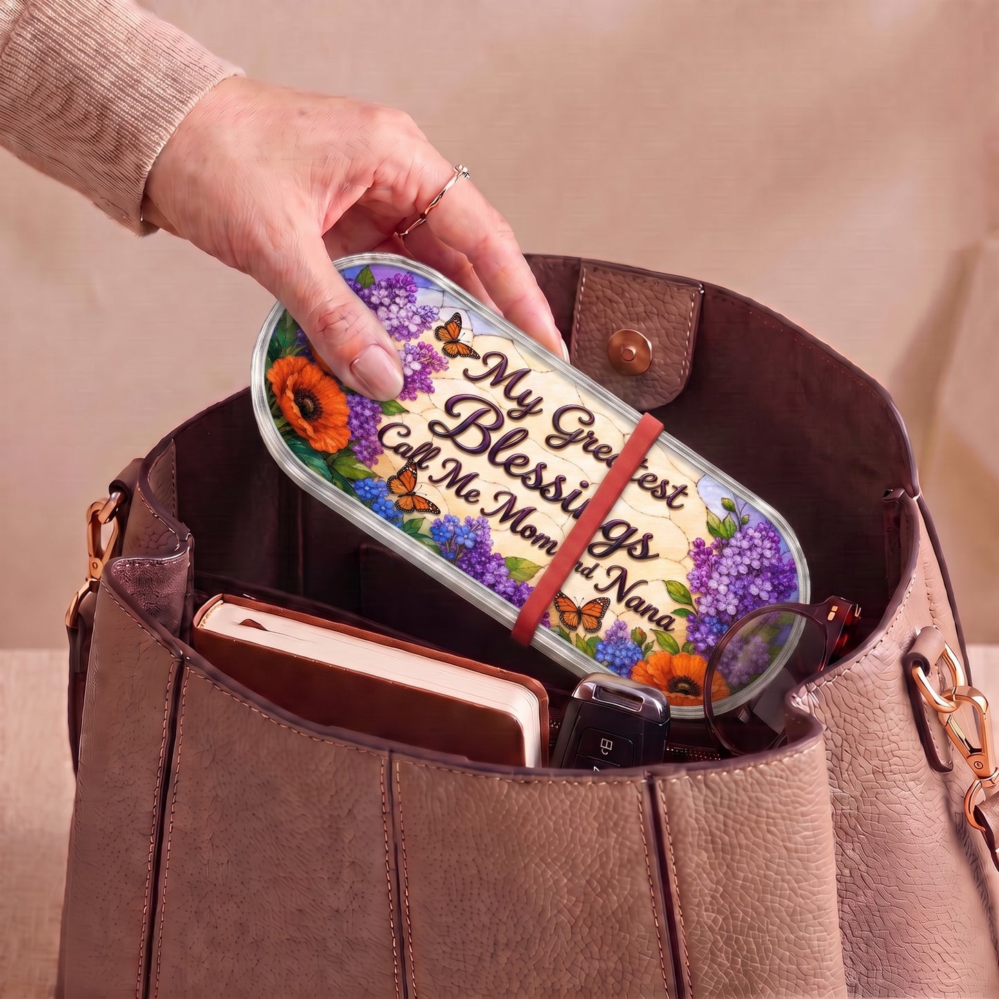 My Greatest Blessings Call Me Mom and Nana floral Pillcase carried inside a handbag with everyday essentials
