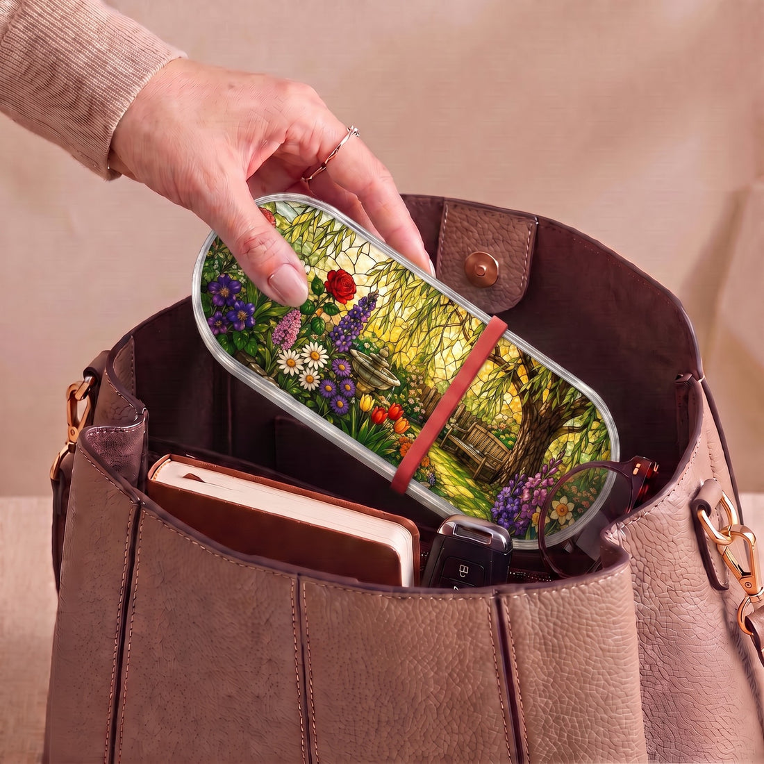 Peaceful Garden Retreat floral Pillcase carried inside a handbag with everyday essentials
