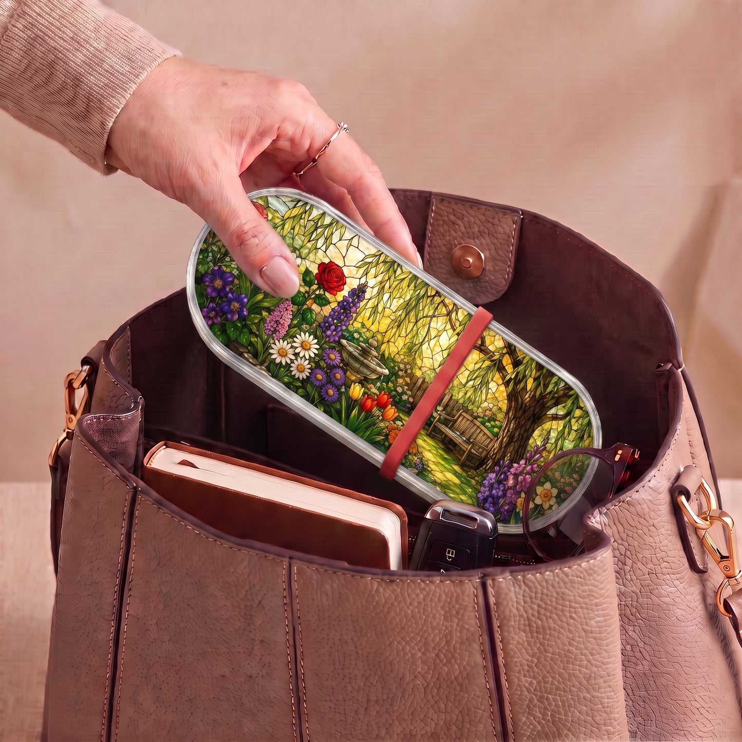 Peaceful Garden Retreat floral Pillcase carried inside a handbag with everyday essentials