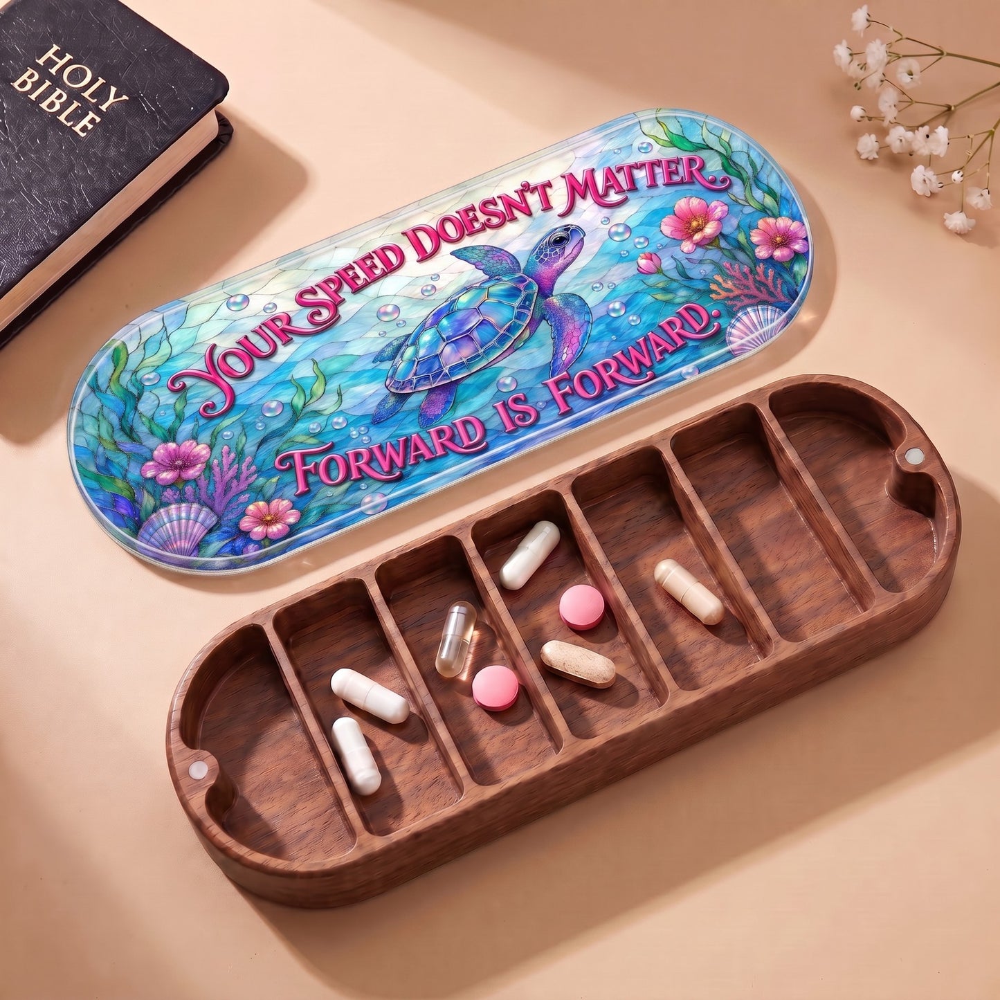 Open wooden Pillcase with sea turtle lid, Holy Bible and daily tablets